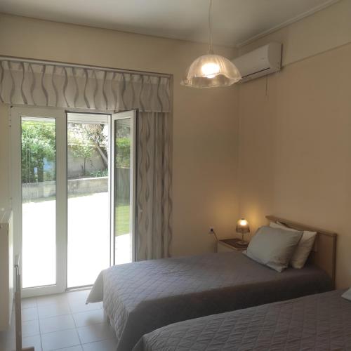 Postel nebo postele na pokoji v ubytování Sea Breeze Villa
