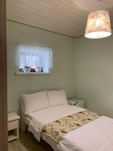 Ένα ή περισσότερα κρεβάτια σε δωμάτιο στο Pogar Inn