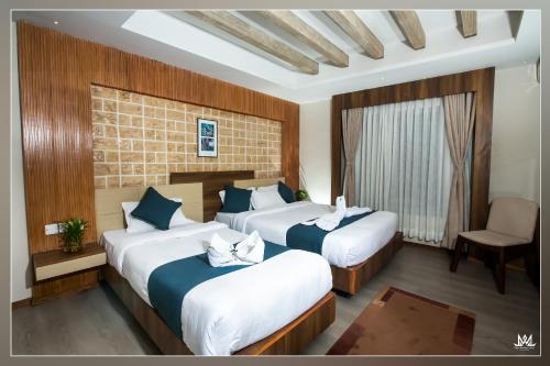 Кровать или кровати в номере Hotel Maya Boutique and Apartment, Thamel