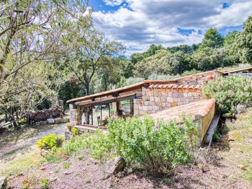 a stone house in the middle of a field at Holiday Home Chez Canard by Interhome in Ampus