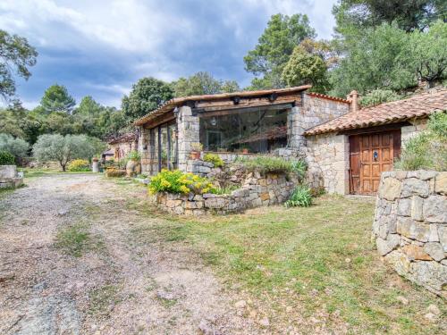 an old stone house with a stone wall at Holiday Home Chez Canard by Interhome in Ampus