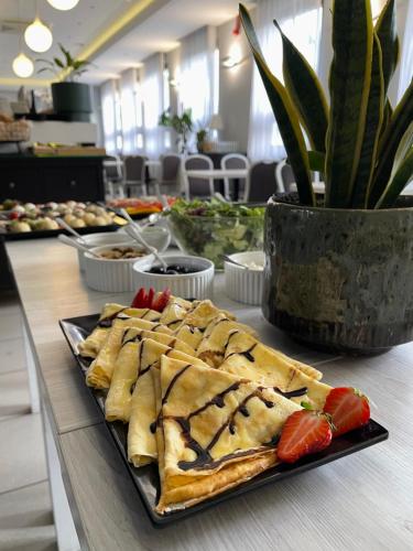 a plate of food sitting on a table at Villa Garden in Oleśnica