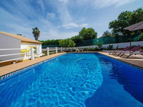 a swimming pool with blue water in a house at Holiday Home Monte Novo by Interhome in Paderne