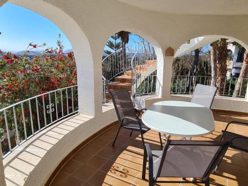 a patio with a table and chairs on a balcony at Holiday Home Zindel by Interhome in Balcon del Mar
