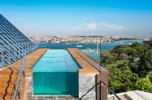 a swimming pool on a building with a view of the water at The Ritz-Carlton, Istanbul at the Bosphorus in Istanbul