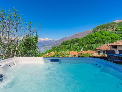 a swimming pool with a view of the mountains at Holiday Home Villa Canonica by Interhome in Perledo
