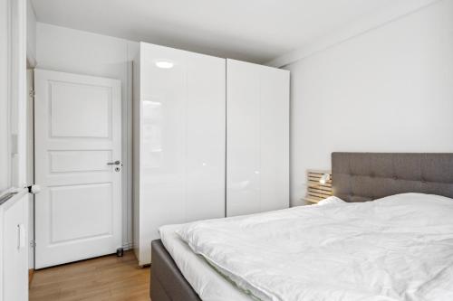 Postel nebo postele na pokoji v ubytování Come Stay - 2BR Det perfekte hjem for 5