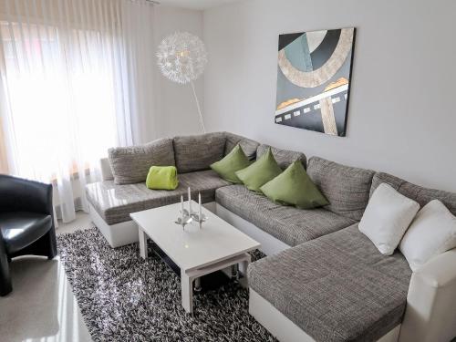 a living room with a couch and a table at Apartment Utoring Acletta-1 by Interhome in Disentis