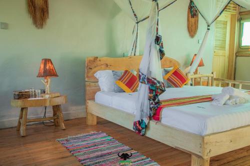 Ένα ή περισσότερα κρεβάτια σε δωμάτιο στο Embogo Safari Lodges