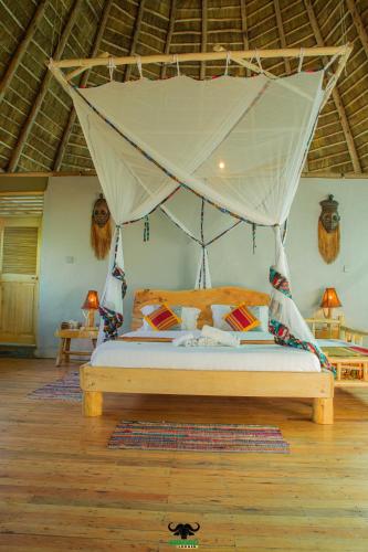 Ένα ή περισσότερα κρεβάτια σε δωμάτιο στο Embogo Safari Lodges