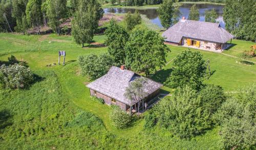 an aerial view of a house in a field at Līgatnes Zemturi in Augšlīgatne
