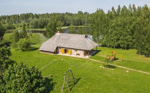 an aerial view of a house in a field at Līgatnes Zemturi in Augšlīgatne
