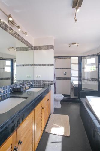 a bathroom with a sink and a toilet at Casa Montaza 4 Bedroom Villa with private pool in Lagos in Lagos