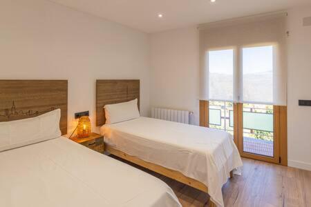 Ένα ή περισσότερα κρεβάτια σε δωμάτιο στο Apartament els Pics Cerdans