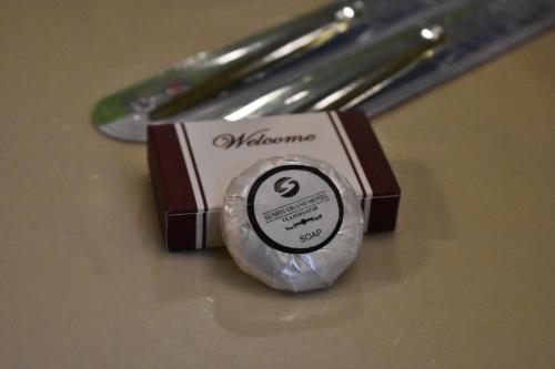 a close up of a small box with a knife at Sunjin Grand Hotel in Ulaanbaatar