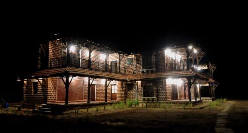 a building at night with lights on it at Verandah By The Sea in Vengurla