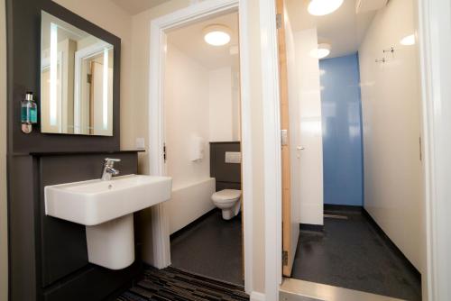 a bathroom with a sink and a toilet at YHA Cambridge in Cambridge