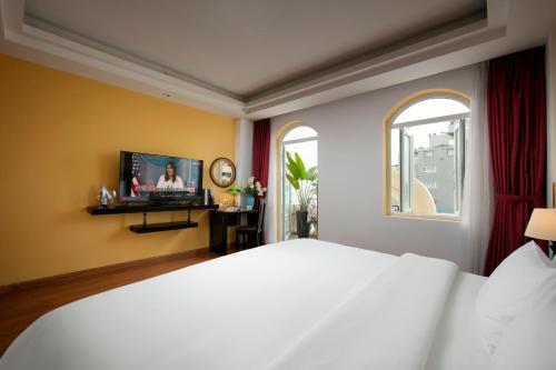 TV a/nebo společenská místnost v ubytování Hanoi Harmonia Hotel & Spa