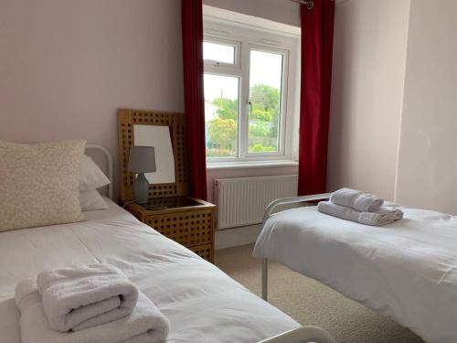 Stunning Victorian Dartmoor House tesisinde bir odada yatak veya yataklar