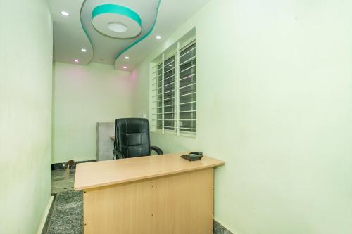 A television and/or entertainment centre at OYO GREEN RESIDENCY