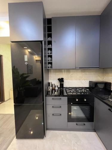 Kuchyň nebo kuchyňský kout v ubytování Welcome apartament