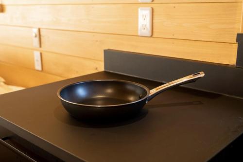 a frying pan sitting on top of a counter at Tyni Katsuura in Katsuura
