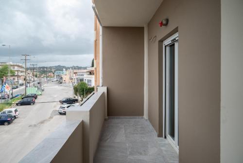 a balcony of a building with a view of a street at KA Luxury Apartments in Mantoúkion