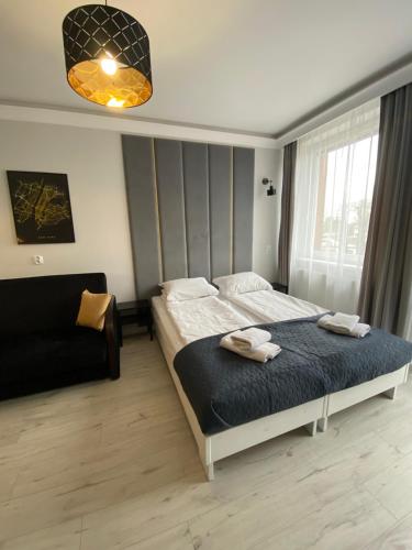 A bed or beds in a room at Apartament 308 Planeta