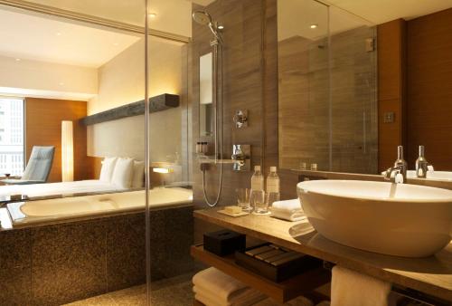a bathroom with a sink and a shower at Hyatt Regency Tokyo in Tokyo