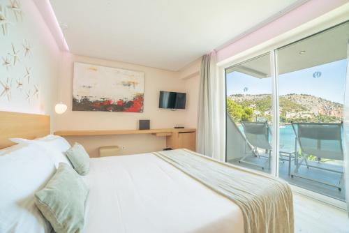 Katil atau katil-katil dalam bilik di Melbeach Hotel & Spa - Adults Only