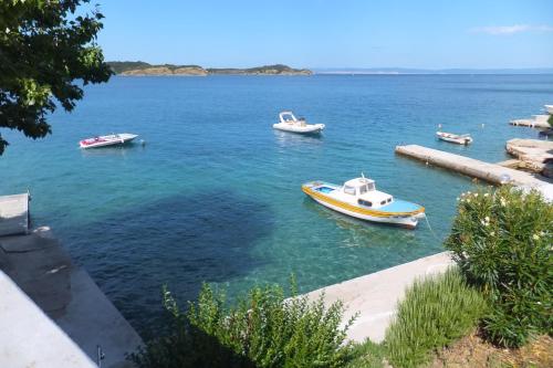 a group of boats in a large body of water at Apartments Justić in Supetarska Draga