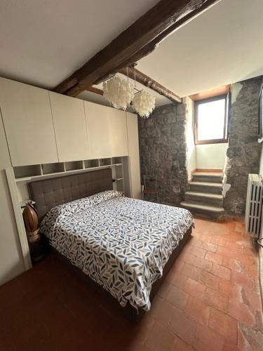 Postel nebo postele na pokoji v ubytování La Casetta al Corso