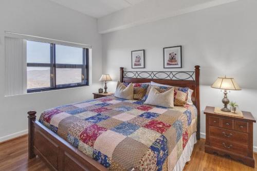 a bedroom with a bed and a window at Handsome 2BR Condo with Gorgeous Views in Sugar Mountain! condo in Sugar Mountain