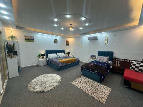 a large room with a bed and a couch at Jerash City View in Jerash