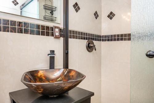 a bathroom with a bowl sink on a counter at ATL Downtown City View Onsite Parking LM802 in Atlanta