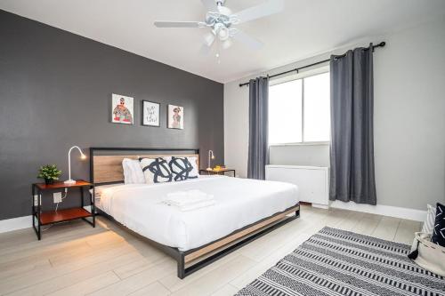 a bedroom with a large white bed and a window at ATL Downtown 2BR King Bed Free Parking LM1003 in Atlanta