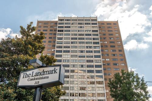 a sign in front of a tall building at Atlanta Downtown! King Bed! Paid Onsite Parking! LM2102 in Atlanta