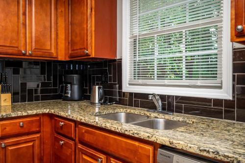 a kitchen counter with a sink and a window at NEW ENTIRE PLACE COZY QUIET 2b2b TOWNHOUSE SP1261 in Norcross