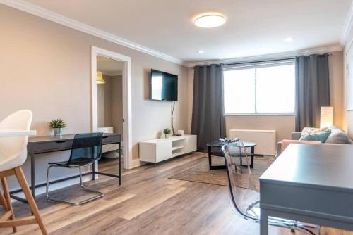a living room with a table and a couch at Downtown 18th FL! City View& Onsite Parking LM1807 in Atlanta