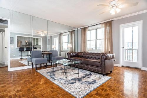 a living room with a couch and a table at ENTIRE CONDO! Downtown! 24 Concierge! 9B in Atlanta