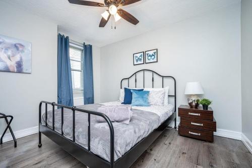 a bedroom with a bed and a ceiling fan at ATL Downtown Private Balcony 24h Concierge PT6F in Atlanta