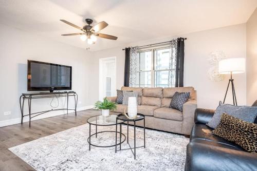 a living room with a couch and a tv at ATL Downtown Private Balcony 24h Concierge PT6F in Atlanta