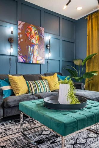 a living room with a couch and a table at Downtown New Built Roof top balcony City View 525Pkwy in Atlanta