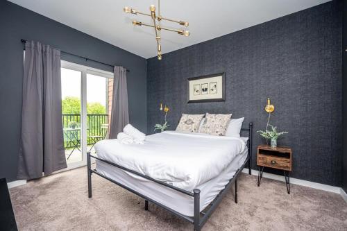 a bedroom with a large bed and a window at ATL Downtown New-Built Roof-top balcony City View 525#412 in Atlanta