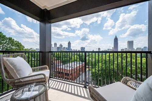 a balcony with chairs and a view of the city at Downtown New-Built Roof-top balcony City View 525Pkwy in Atlanta