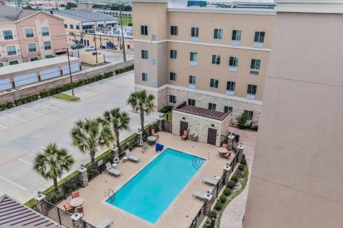 an overhead view of a swimming pool at a apartment at Hotel Room Kitchen Free parking Washer&Dryer Gym Relux Studio Group 2 in Houston