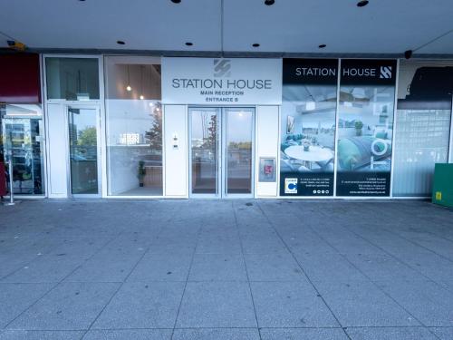 a store front of a building with windows and doors at Stunning City View Apartments in Milton Keynes Central Location Free Parking in Milton Keynes