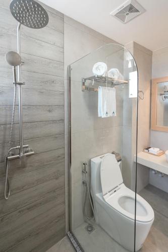 a bathroom with a toilet and a shower at Ayala Oceanview Maldives in Gulhi