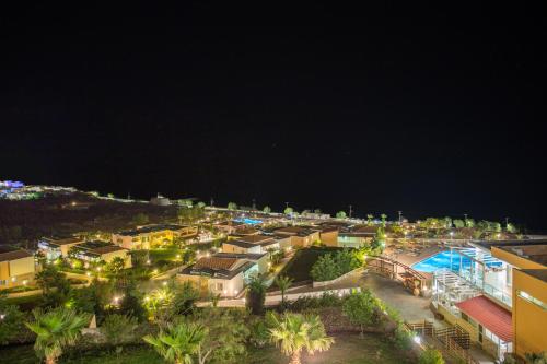 an aerial view of a city at night at Grand Blue Beach Hotel in Kardamaina