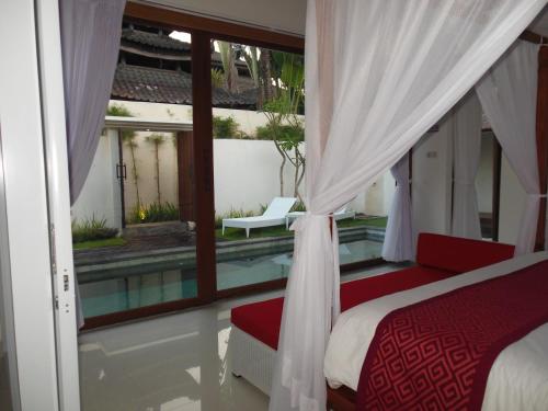 Ένα ή περισσότερα κρεβάτια σε δωμάτιο στο HK Villa Bali